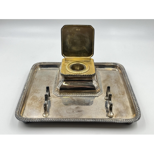 2222 - A George V Goldsmiths & Silversmiths Co. Ltd. hallmarked London silver desk tidy with inkwell and pe... 