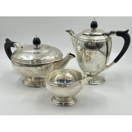 2224 - A Mappin & Webb hallmarked Sheffield silver three piece tea/coffee set, dated 1945 - approx. gross w... 