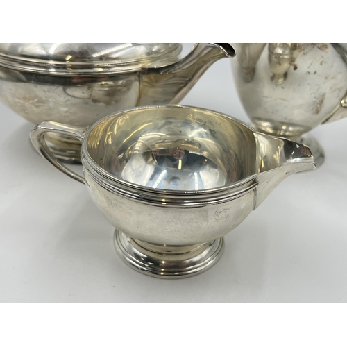 2224 - A Mappin & Webb hallmarked Sheffield silver three piece tea/coffee set, dated 1945 - approx. gross w... 