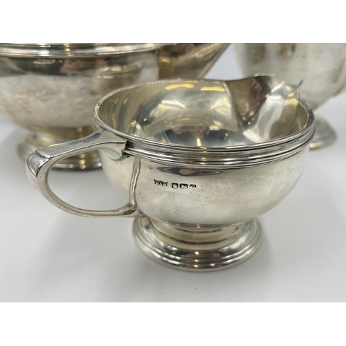 2224 - A Mappin & Webb hallmarked Sheffield silver three piece tea/coffee set, dated 1945 - approx. gross w... 