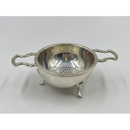 2231 - A hallmarked Birmingham silver tea strainer and bowl, dated 1964 - approx. gross weight 75g