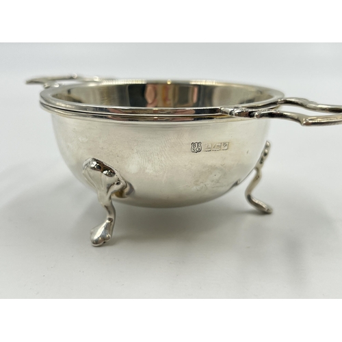 2231 - A hallmarked Birmingham silver tea strainer and bowl, dated 1964 - approx. gross weight 75g