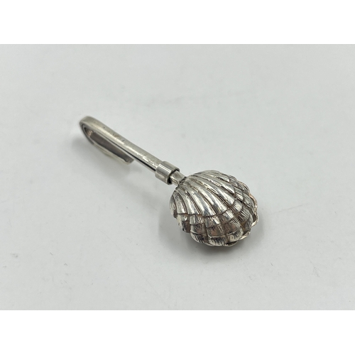 2232 - A hallmarked London silver scallop napkin clip, dated 2002 - approx. gross weight 7.8g