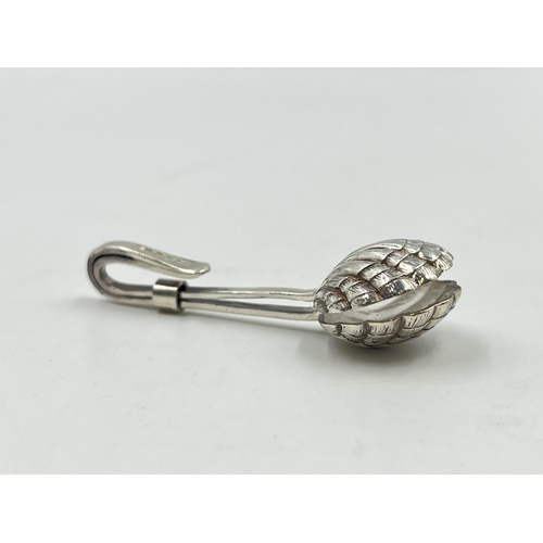 2232 - A hallmarked London silver scallop napkin clip, dated 2002 - approx. gross weight 7.8g