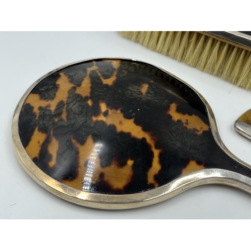 2236 - A hallmarked London silver and tortoiseshell four piece dressing table set, dated 1925 - approx. gro... 