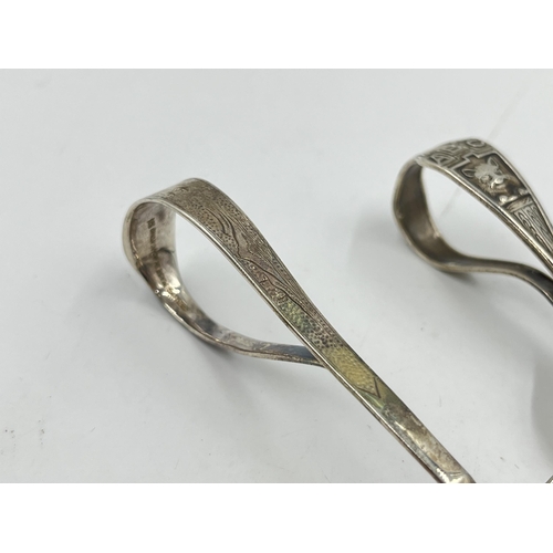 2252 - Two .925 silver baby spoons, one Chinese and one American - approx. gross weight 34g