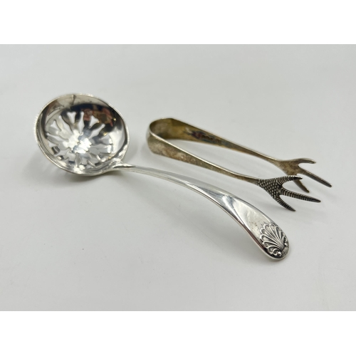 2286 - Two pieces of sterling silver, one spoon and one pair of sugar tongs - approx. 29g