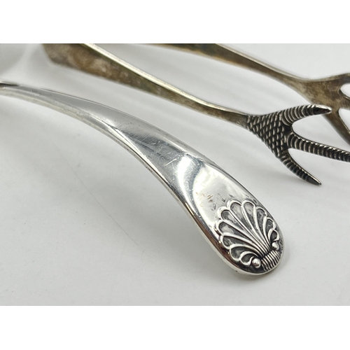 2286 - Two pieces of sterling silver, one spoon and one pair of sugar tongs - approx. 29g