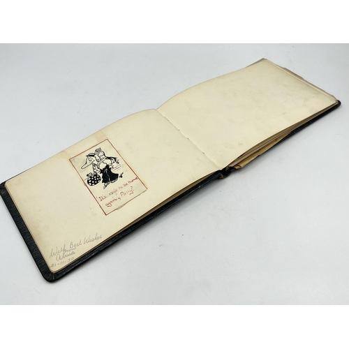 2345 - An early 20th century autograph album with contents