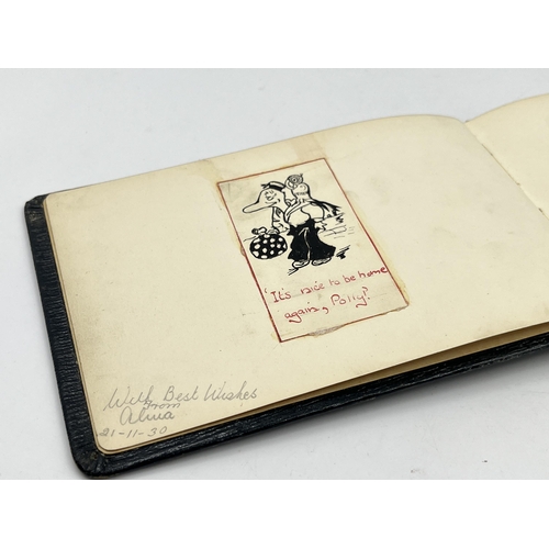 2345 - An early 20th century autograph album with contents