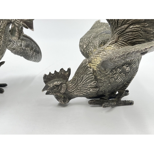 2345A - A pair of French metal fighting rooster figurines - largest approx. 18cm high