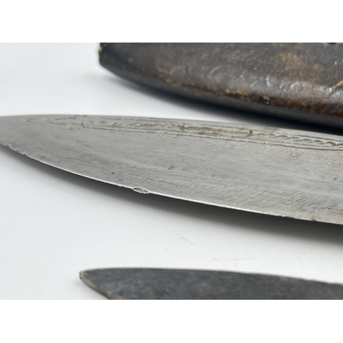 2360 - A kukri knife with sheath and two further small knives