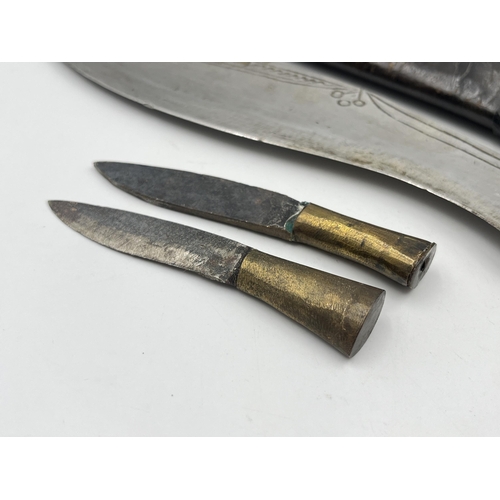 2360 - A kukri knife with sheath and two further small knives