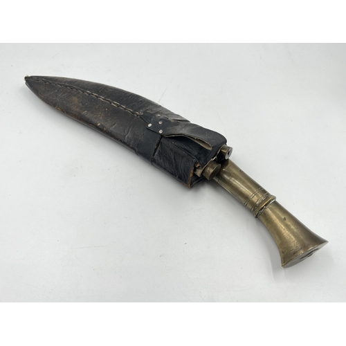 2360 - A kukri knife with sheath and two further small knives