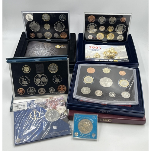 2365 - A collection of cased coin sets to include 1997, 2001, 2003, 2004, 2005, 2008, 2009 five pound to on... 