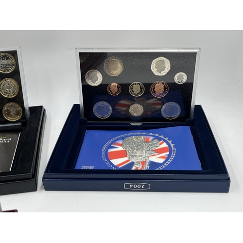 2365 - A collection of cased coin sets to include 1997, 2001, 2003, 2004, 2005, 2008, 2009 five pound to on... 