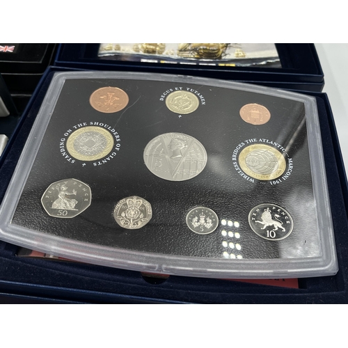 2365 - A collection of cased coin sets to include 1997, 2001, 2003, 2004, 2005, 2008, 2009 five pound to on... 