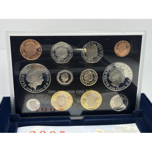 2365 - A collection of cased coin sets to include 1997, 2001, 2003, 2004, 2005, 2008, 2009 five pound to on... 