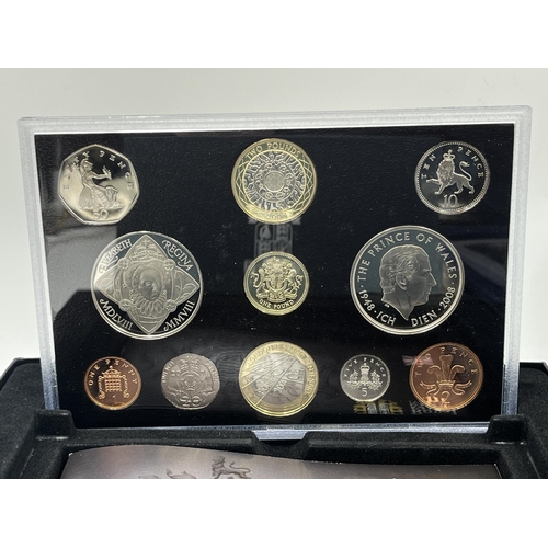 2365 - A collection of cased coin sets to include 1997, 2001, 2003, 2004, 2005, 2008, 2009 five pound to on... 