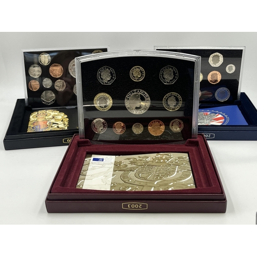 2365 - A collection of cased coin sets to include 1997, 2001, 2003, 2004, 2005, 2008, 2009 five pound to on... 