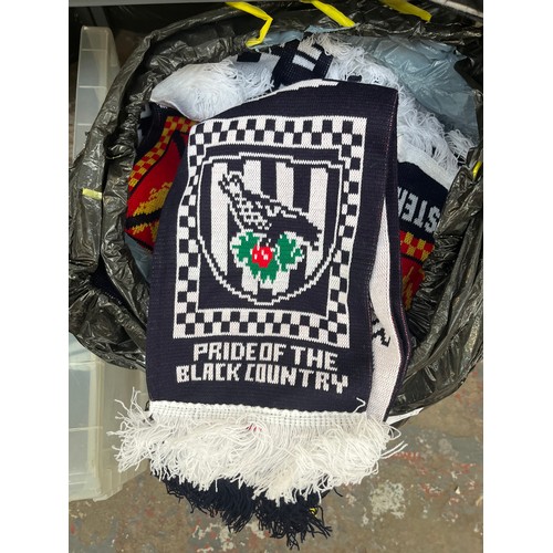 965A - Three bags containing a large quantity of sports scarves and t-shirts to include Huddersfield, Manch... 