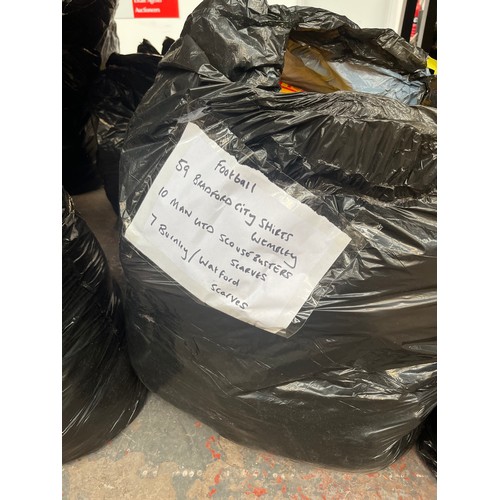 965A - Three bags containing a large quantity of sports scarves and t-shirts to include Huddersfield, Manch... 