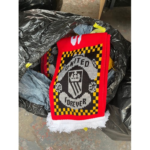 965A - Three bags containing a large quantity of sports scarves and t-shirts to include Huddersfield, Manch... 