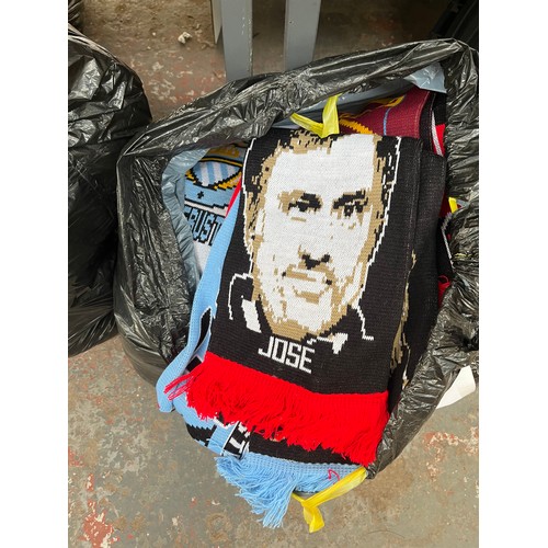 965A - Three bags containing a large quantity of sports scarves and t-shirts to include Huddersfield, Manch... 