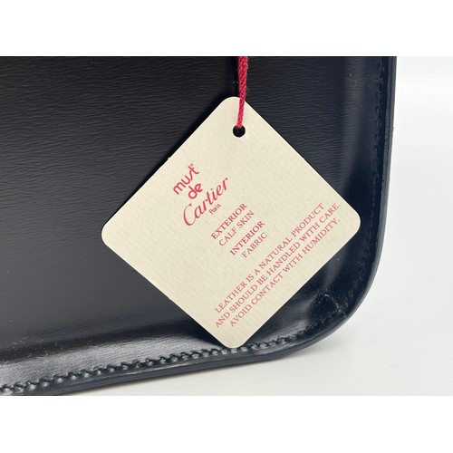 428 - A boxed Cartier Panthère black leather handbag with coin purse, dust cover and guarantee card - no. ... 