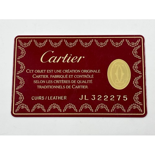 428 - A boxed Cartier Panthère black leather handbag with coin purse, dust cover and guarantee card - no. ... 