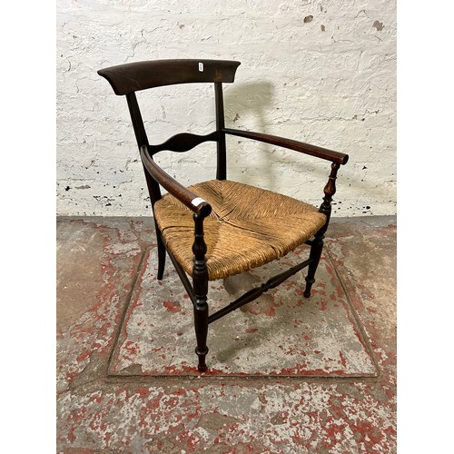 22B - A late 19th/early 20th century beech and rush seated armchair