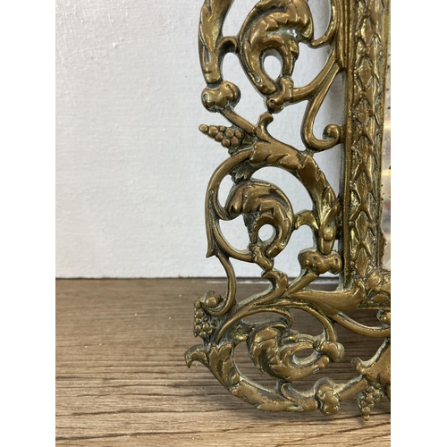 331 - A 19th century cast brass figural wall mirror with Bacchus top and bevelled glass plate - approx. 37... 