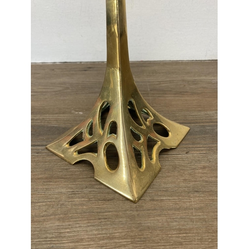 334 - An Art Nouveau style brass candlestick - approx. 37cm high