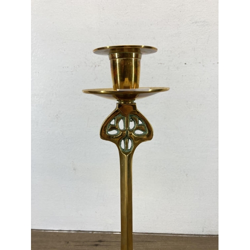 334 - An Art Nouveau style brass candlestick - approx. 37cm high