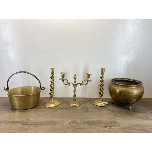 341 - Five pieces of antique and later brassware, a pair of barley twist candlesticks - approx. 31cm high,... 