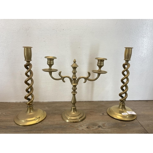 341 - Five pieces of antique and later brassware, a pair of barley twist candlesticks - approx. 31cm high,... 