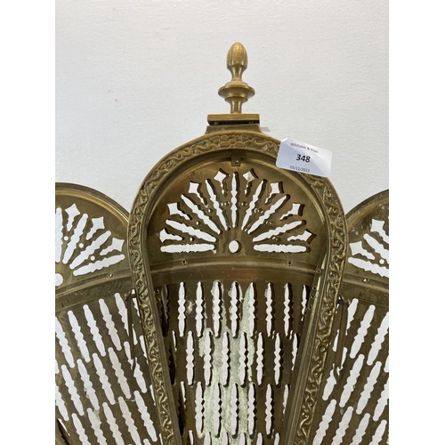 348 - A 19th century style brass peacock fire screen