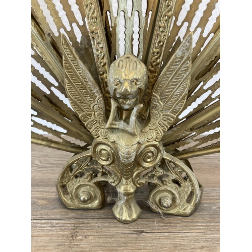 348 - A 19th century style brass peacock fire screen