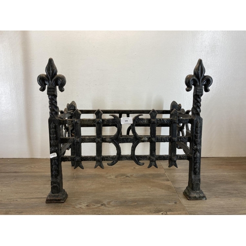 349 - Two vintage fireside accessories, one 19th century style cast iron fire grate - approx. 45cm high x ... 