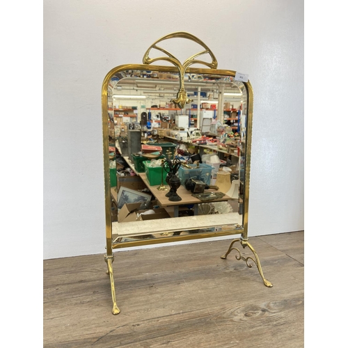 351 - An Art Nouveau brass and mirrored glass fire screen - approx. 65cm high x 40cm wide