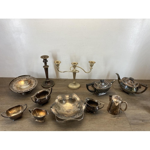 355 - A collection of antique and later metalware to include copper candlestick, three branch candelabra, ... 