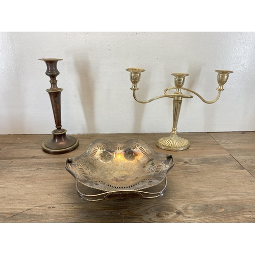 355 - A collection of antique and later metalware to include copper candlestick, three branch candelabra, ... 