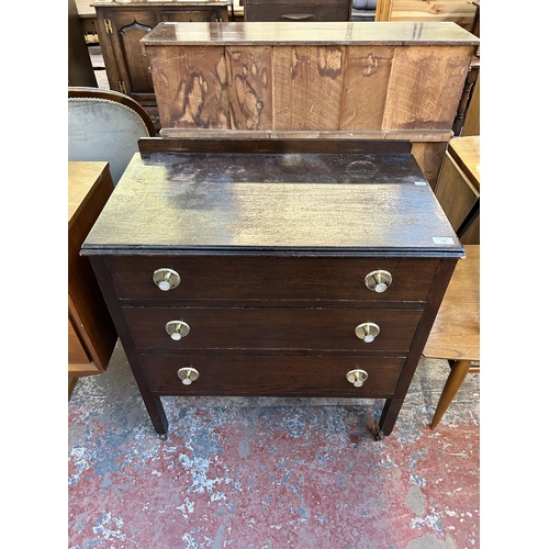 128 - An oak chest of drawers - approx. 81cm high x 74cm wide x 41cm deep