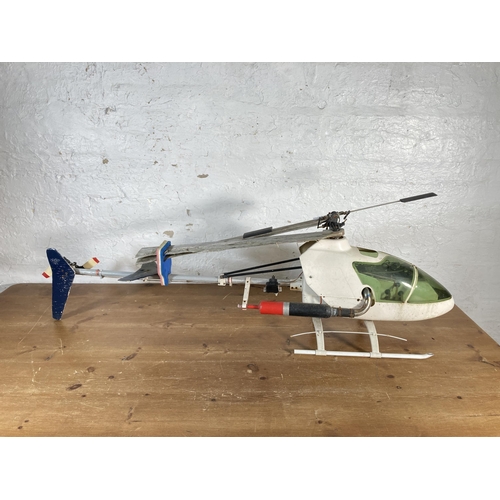 372 - Two radio controlled nitro helicopters