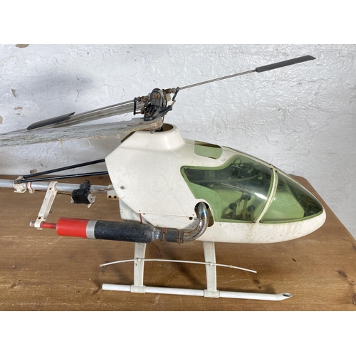 372 - Two radio controlled nitro helicopters