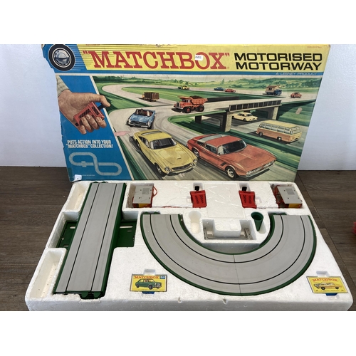 374 - Two Matchbox items, one motorised motorway slot car set and one Vincent series C black shadow model ... 