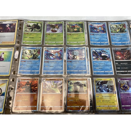 377 - A collection of Pokémon cards to include Pikachu, Machamp etc.