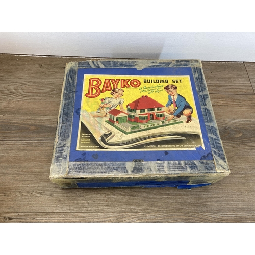 378 - A mid 20th century boxed Bayko building set with various additional accessories