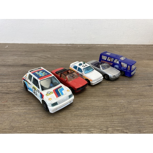 382 - A collection of vintage diecast model vehicles to include Corgi V12 Jaguar, Bburago Peugeot 205 turb... 