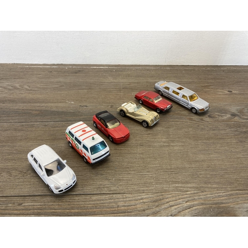 382 - A collection of vintage diecast model vehicles to include Corgi V12 Jaguar, Bburago Peugeot 205 turb... 